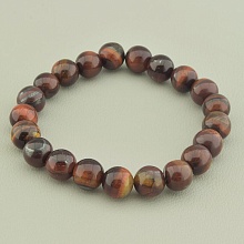 картинка Браслет из Бычьего глаза, коричневый на резинке 'SUNSTONES' 19 см от магазина Wolves