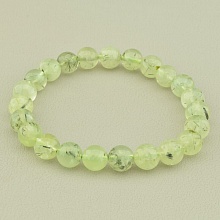 картинка Браслет из пренита, зеленое на резинке 'SUNSTONES' 19 см от магазина Wolves