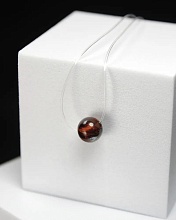 картинка Чокер невидимка с камнем Бычий глаз от магазина Wolves