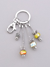 картинка Брелок 'Vogue'  Бижутерный сплав 9 см от магазина Wolves